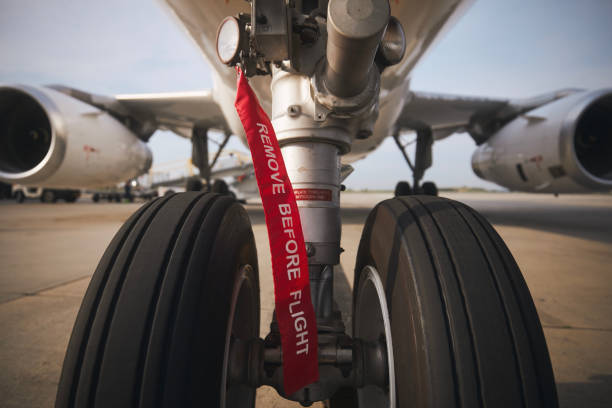 istock Aircraft nose wheel with flag Remove Before Flight 1421886075
