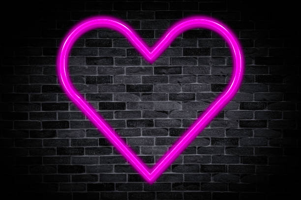 istock Heart symbol sign neon banner on brick wall background with copy space. 1421886822