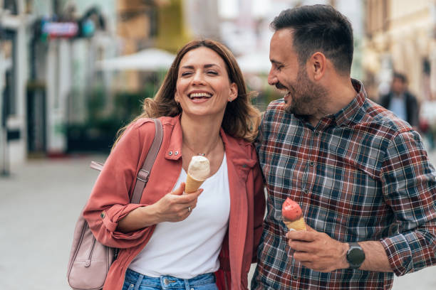 istock Happy couple eating ice cream 1421886912