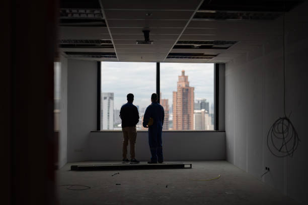 istock construction building manger visit site and meet with supervisor at the incomplete room and discuss about new tower 1421889028