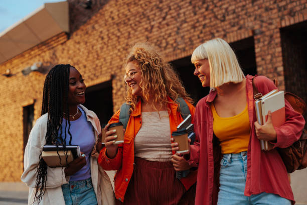 istock Cheerful female students at campus. 1421890615