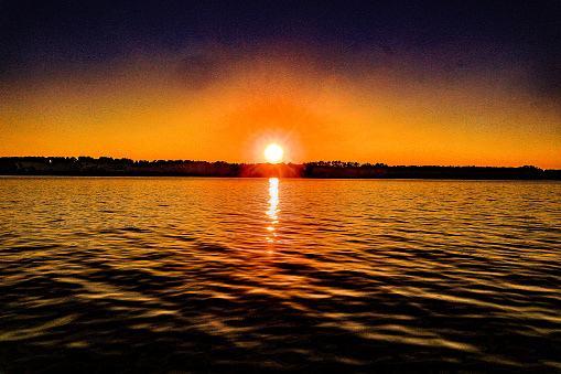 The sun is about down and out for the night in this sunset shot taken on beautiful Lake Sinclair in Milledgeville, Georgia.
