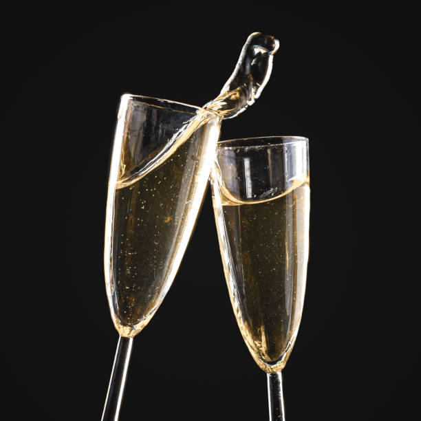 istock Glasses of champagne with splash 1421898151