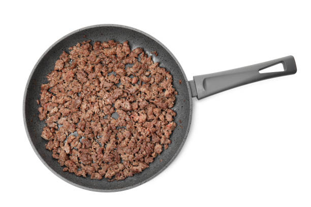 istock Pan with fried minced meat isolated on white, top view 1421899222