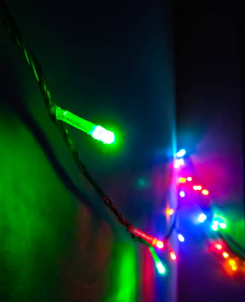 istock Black background with fairy light effects. Beautiful background with selective focus. Special occasion concept with space for text. 1421909988