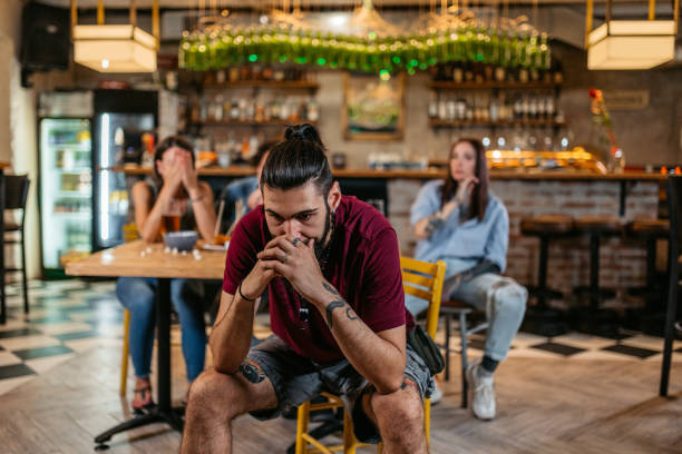 istock Young Man Disappointed While Watching A Sports Game In A Bar 1421910756
