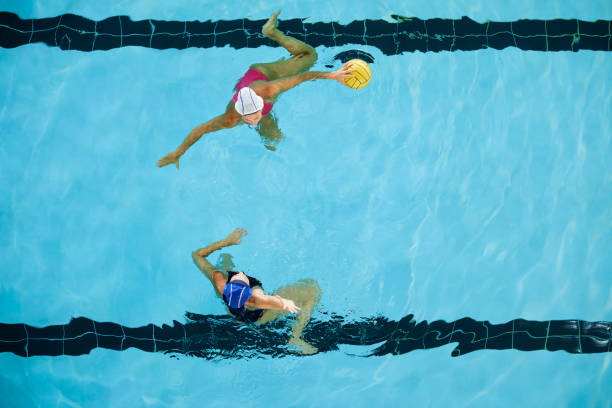 istock Professional woman water polo game action. 1421910929