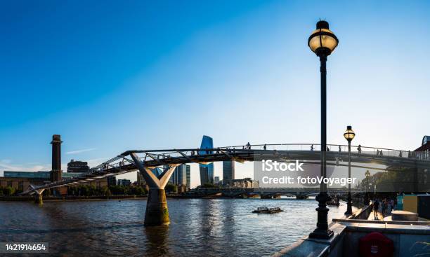 London People Silhouetted On Millennium Bridge And River Thames Embankment Stock Photo - Download Image Now