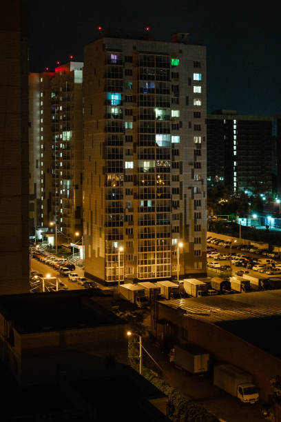 istock Multi-storey residential building in night lighting 1421919612