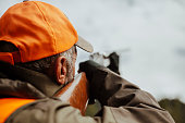 photo of hunter aiming with rifle