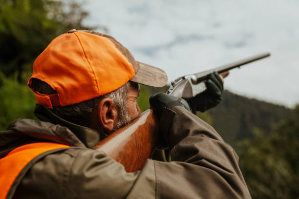 istock photo of hunter aiming with rifle 1421919805