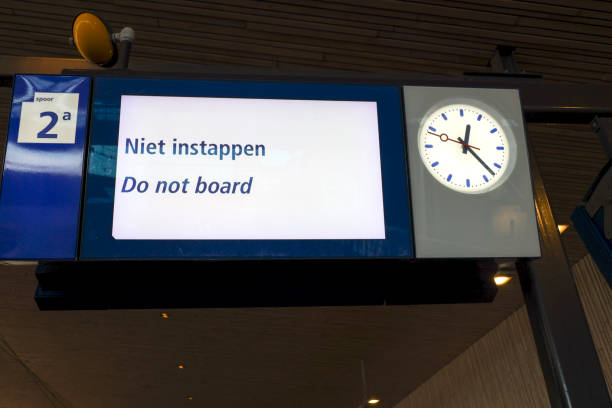 Text Niet instappen (Do not board) on display at platform Rotterdam Central station Text Niet instappen (Do not board) on display at platform Rotterdam Central station in the Netherlands instappen stock pictures, royalty-free photos & images