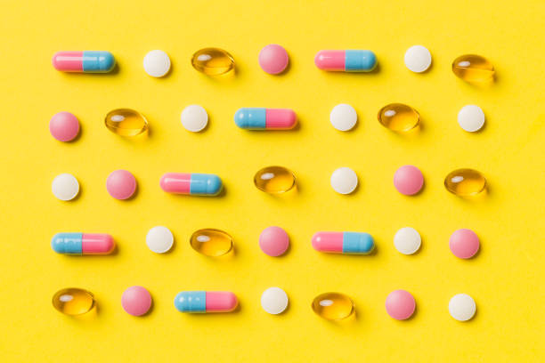 istock Many different pills and space for text on colorful background, top view. Different pills on color background, flat lay 1421925851