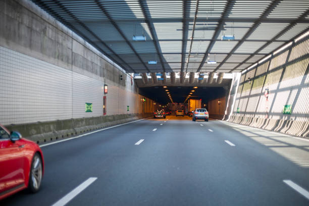 Brielle, The Netherlands - September 06, 2021: Traffic on Dutch rijksweg A 15 nearby Rotterdam / Brielle. The A15 motorway (Dutch: Rijksweg 15) is a motorway in the Netherlands. It connects the Maasvlakte and Rotterdam in the West with the city of Enschede in the East. Some road users in the background.