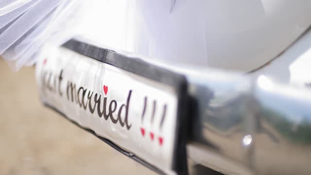 Vintage wedding car with just married sign, selective focus