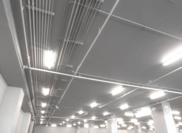 istock Installation of Electrical metallic conduits on the ceiling 1421927636