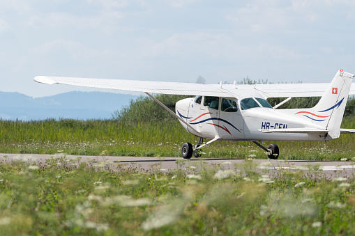 Wangen-Lachen, Switzerland, July 31, 2022 Reims Cessna 172P Skyhawk II propeller plane is landing on a small airfield
