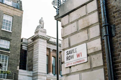 Downing Street sign depicting government, politicians and travel