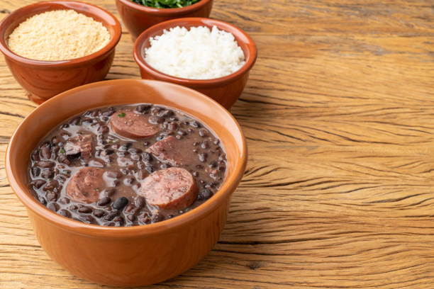 istock Typical brazilian feijoada with farofa, rice, kale and copy space 1421929488