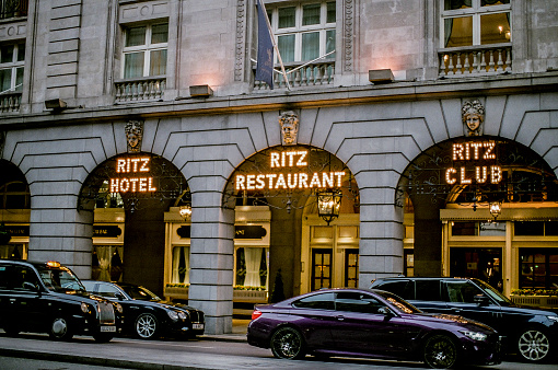 London, England; September 2019; Exterior of The Ritz, London, featuring ironwork, arches, iron lanterns, marquee lights and architectural details