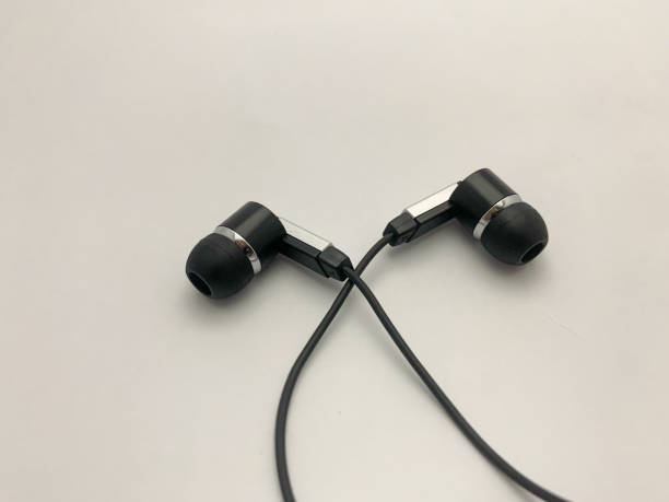 istock Black wire vacuum earplugs isolated on a white background. 1421930251