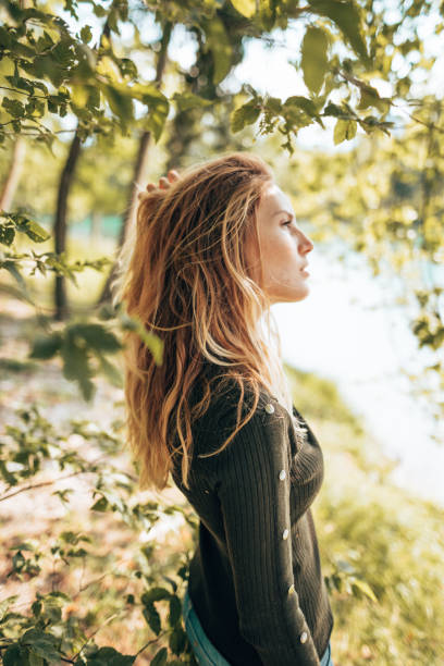 istock beautiful woman in the nature 1421931331