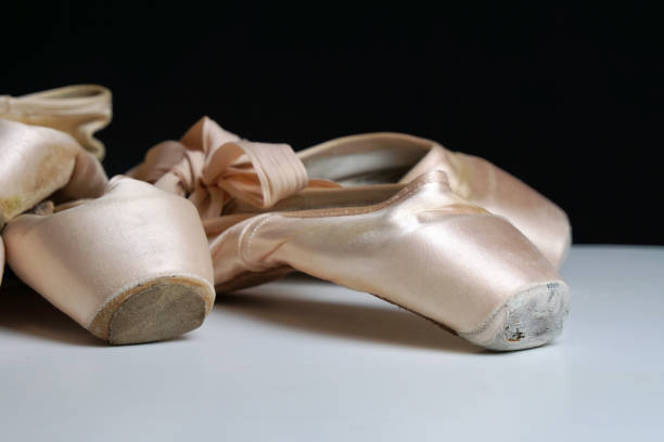 istock old ballet pointe shoes on a white background close-up 1421932932