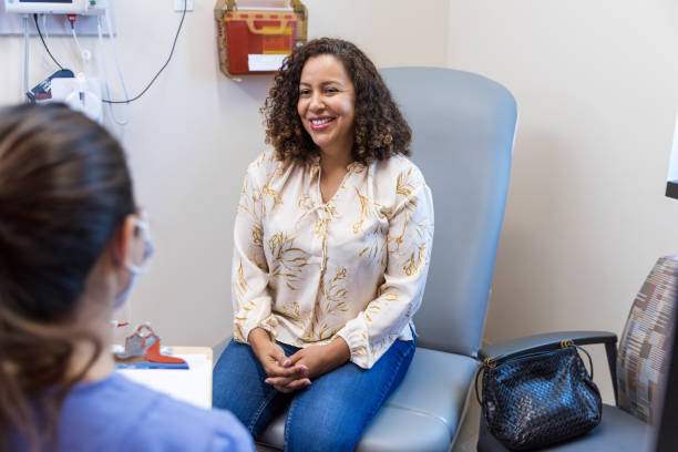 istock Hispanic female talks with the nurse 1421938416