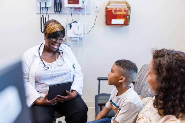 istock Doctor smiles at the boy 1421939002