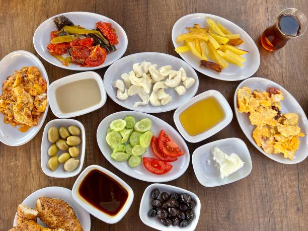 istock turkish breakfast table with variety of cheese, olive, jam, salad and tea 1421940825