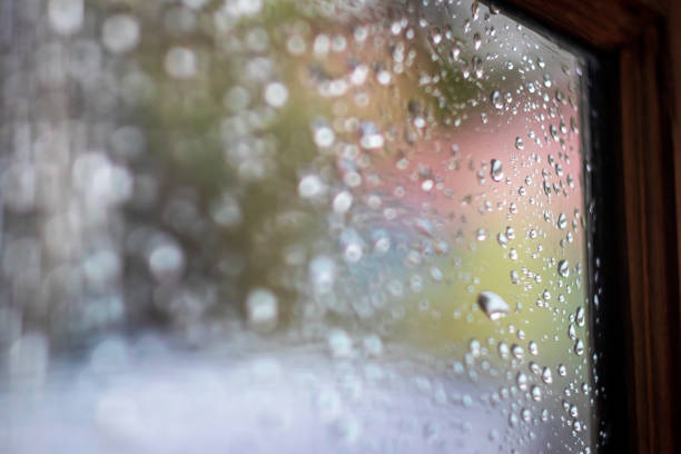 istock Water drops on window glass background after the rain at home. Selective focus. 1421941013