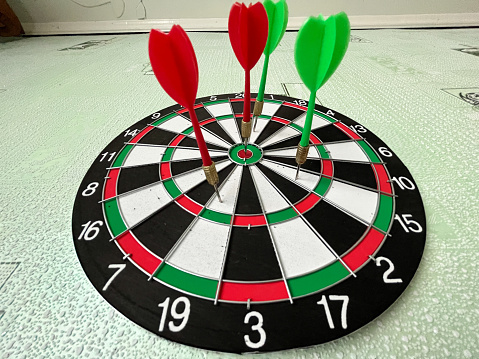 A dart smack in the center of the board.