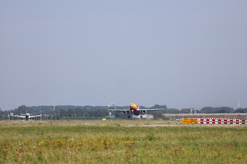 DHL Airbus A300 in rainbow colors on tail departing from Amsterdam Schiphol Airport at Aalsmeerbaan the Neterlands