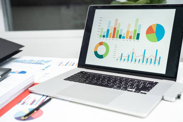 istock Graph data in project in laptop computer in office to analyzing financial reports, finance and business concept. 1421947507