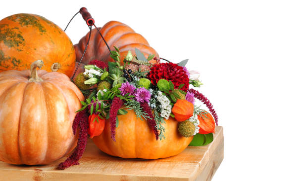 istock Decorative composition of pumpkins and autumn flowers 1421947652