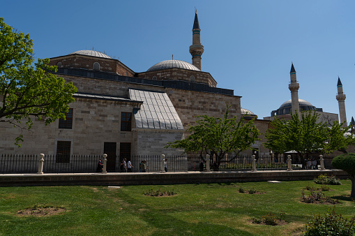 Konya, Turkey- May 13, 2022: Mevlana Mosque and Museum in Konya, Turkey.The ‘Neyzens cemetery' in the garden of Mevlana Mosque