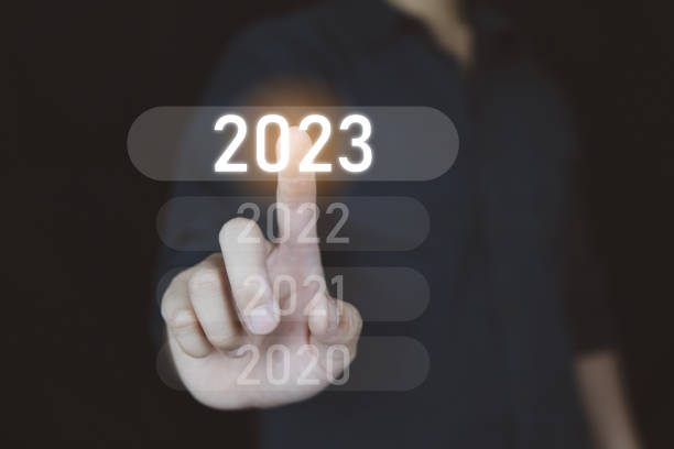 istock Come to 2023 year concept, People selected on 2023 year icon on visual screen. 1421952222
