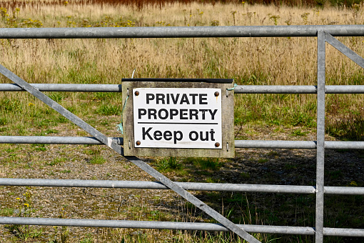 Private Property Keep put sign on a farm gate. No people.