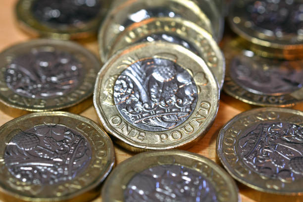 istock Close up view of British one pound coins 1421953709