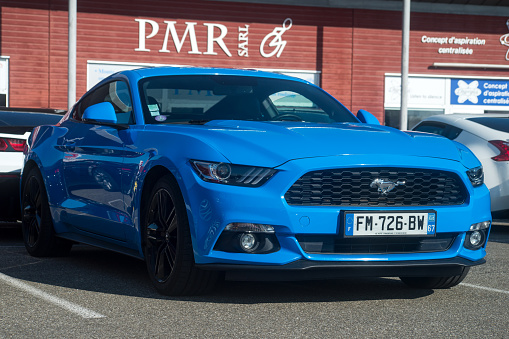 Lutterbach - France - 4 September 2022 - Front view of blue Ford Mustang 500 GT parked in the street