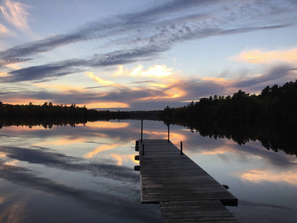 istock Sunset over dock on lake in Fall in Northern Minnesota 1421956003