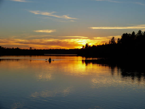 istock Sunset kayaker on the lake in the fall 1421956061