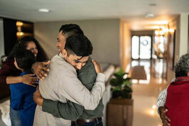 istock Father and son embracing at home 1421959875