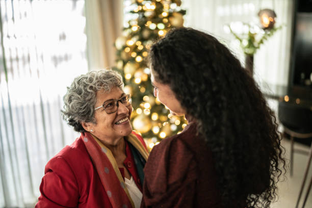 istock Mother and daughter talking during Christmas time at home 1421959935