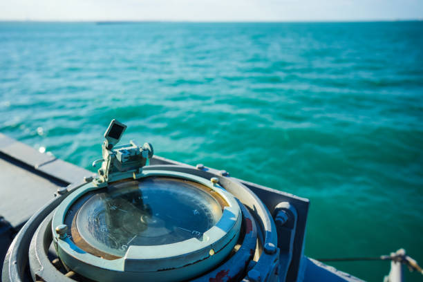 istock Compass on a military ship sailing on the sea 1421960123