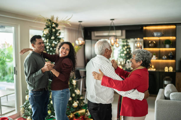 istock Family dancing on Christmas time at home 1421960336