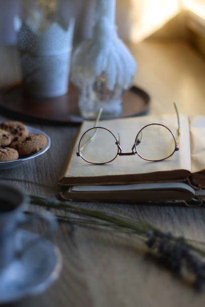 istock Tea, Cookies, Book, Candles and Lavender 1421961349