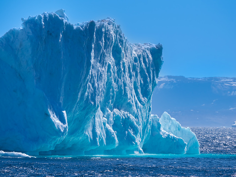 Enormous icebergs with sculptural forms of great beauty crowding the waters of the Disko Bay north of the Artic Circle near Ilulissat, Western Greenland