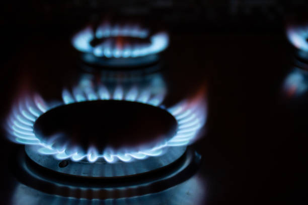 istock Gas burners burn with a blue flame in the dark 1421968168