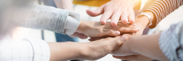 istock Panoramic header image of hand for work together concept, Hand stack for business and service, Volunteer or teamwork togetherness, Connection of community and charity. Team participation. 1421968690